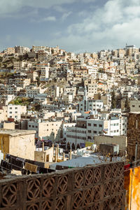 High angle view of buildings in city against sky