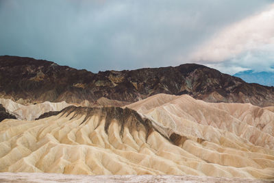 Scenic view of mountain against cloudy sky