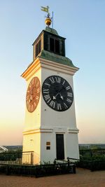 Low angle view of clock tower against sky