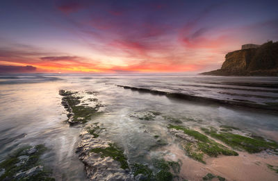 Scenic view of sea against sky during sunset