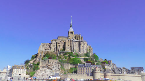 Low angle view of building against blue sky