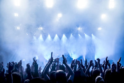 Rear view of crowd enjoying during music concert