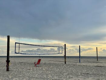 Scenic view of beach against sky during sunset