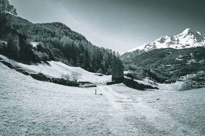 Scenic view of snow covered mountains against sky