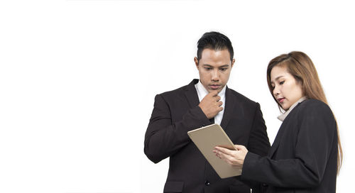 Young woman working on white background