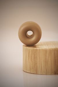Close-up of bread on table against white background