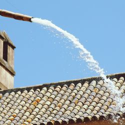 Low angle view of roof against clear sky
