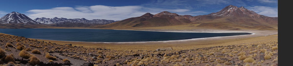 Panoramic view of lake and mountains against sky