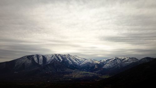 Scenic view of snowcapped mountains against sky