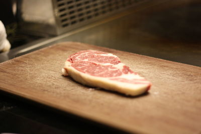 Close-up of meat on cutting board