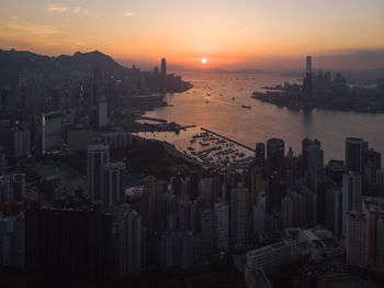 High angle view of city buildings during sunset