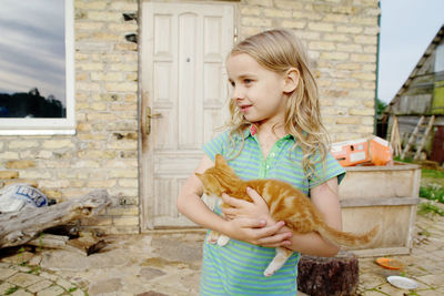 Full length of girl holding food