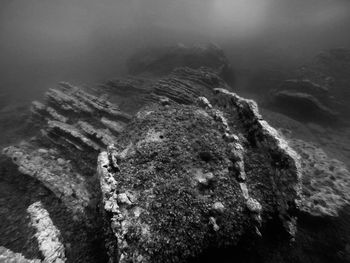 High angle view of rocks in sea