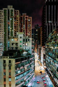 High angle view of illuminated buildings in city at night