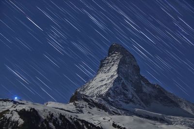 Scenic view of mountain against sky at night