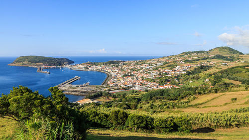 Scenic view of sea and trees against sky