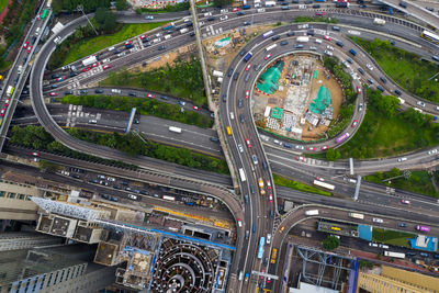 Aerial view of vehicles moving on elevated road in city