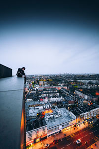 High angle view of illuminated buildings in city against sky