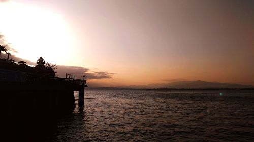 Scenic view of sea against sky at sunset