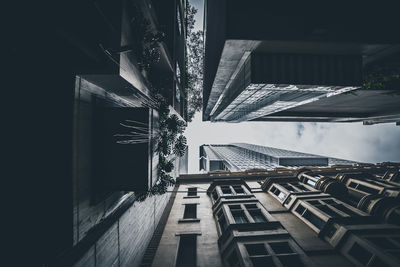 Low angle view of tall buildings against sky