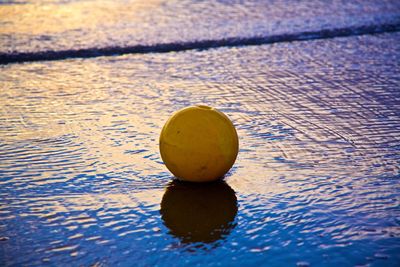 Close-up of ball in calm lake