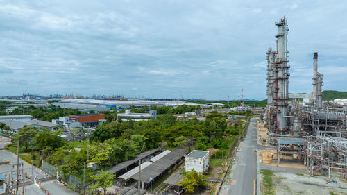 High angle view of buildings by sea against sky