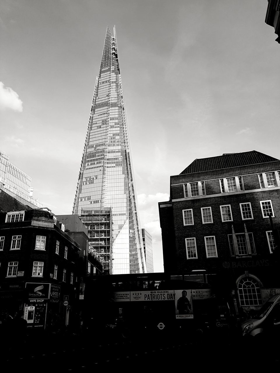 city, architecture, tower, sky, low angle view, built structure, building exterior, travel destinations, skyscraper, outdoors, no people, pyramid, corporate business, day