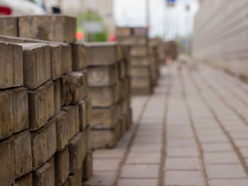 Close-up of stone wall by footpath