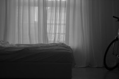 View of bed through window at home