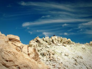 Low angle view of mountain against blue sky