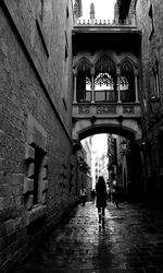 Rear view of woman walking on street