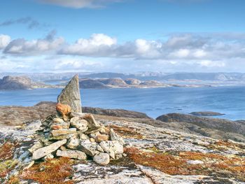 Pebbles pyramid at mountain peak linesfjellet,  linesøya island, norway. stones on mountain peak