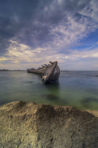 Scenic view of sea against sky at sunset