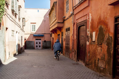 People walking in alley
