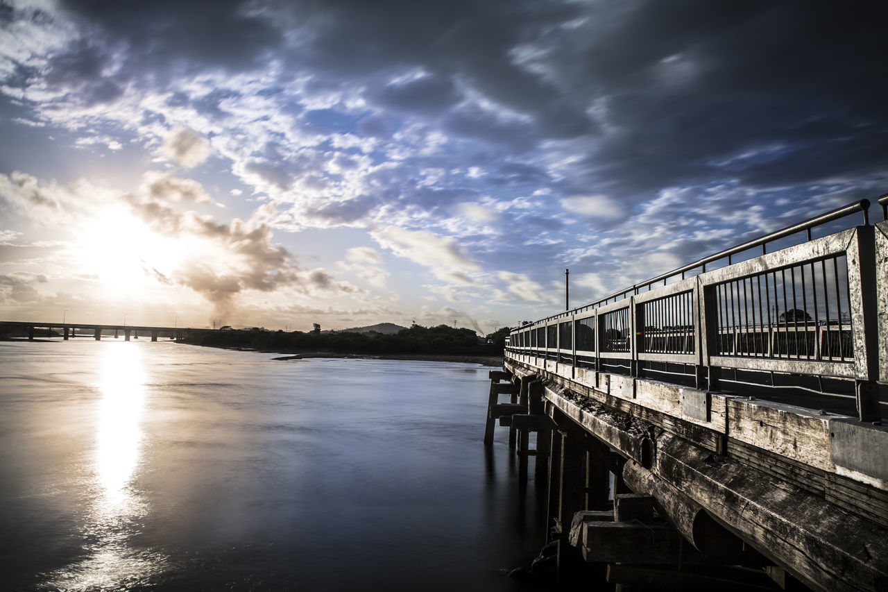 PANORAMIC VIEW OF BRIDGE OVER SEA AGAINST SKY