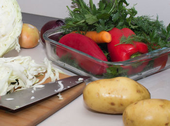 Close-up of fruits and vegetables on cutting board