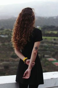 Full length of woman standing in park