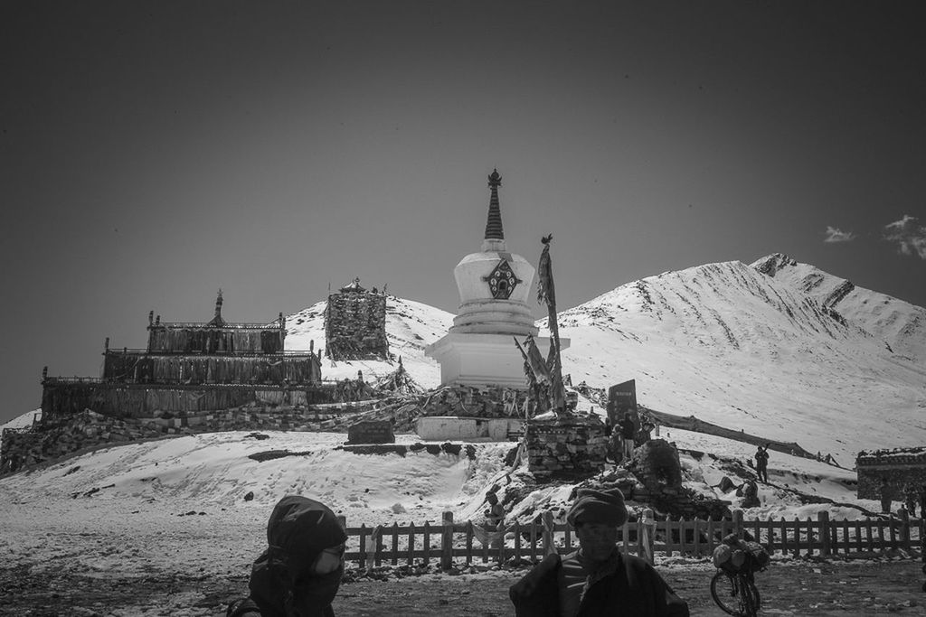 PEOPLE IN FRONT OF TEMPLE