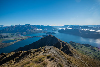 Scenic view of mountains against clear blue sky