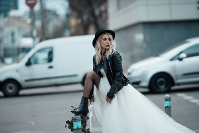 Woman with umbrella in city