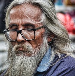 Close-up portrait of man wearing eyeglasses