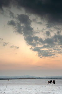 Enjoying the beautiful and colourful sunset over dry salt lake