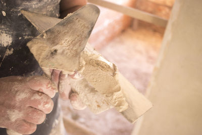 Close-up of man working on wood