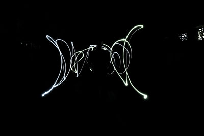 Close-up of light painting against black background