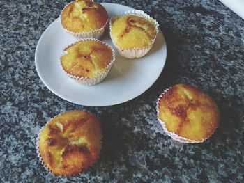 High angle view of muffins in plate on table