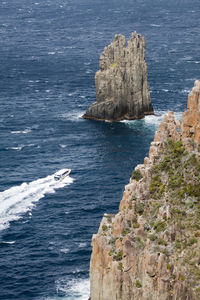 High angle view of rock formation  and boat in sea