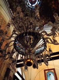 Low angle view of illuminated chandelier