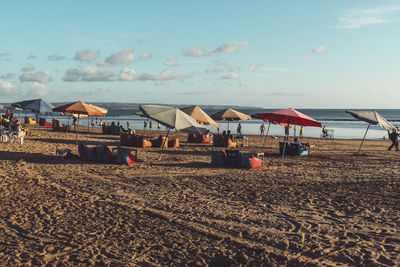 Houses by sea against sky