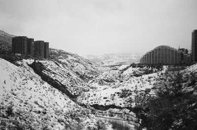 Buildings in city during winter