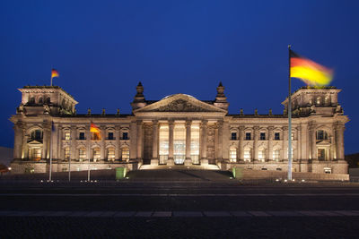 Facade of historical building at night